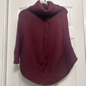 Plum color poncho / sweater with large turtleneck and cableknit detail. Size xxs